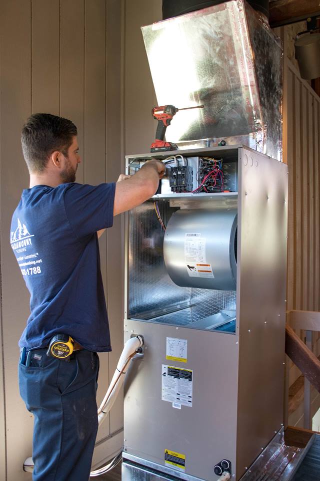 Image of a HVAC system being repaired
