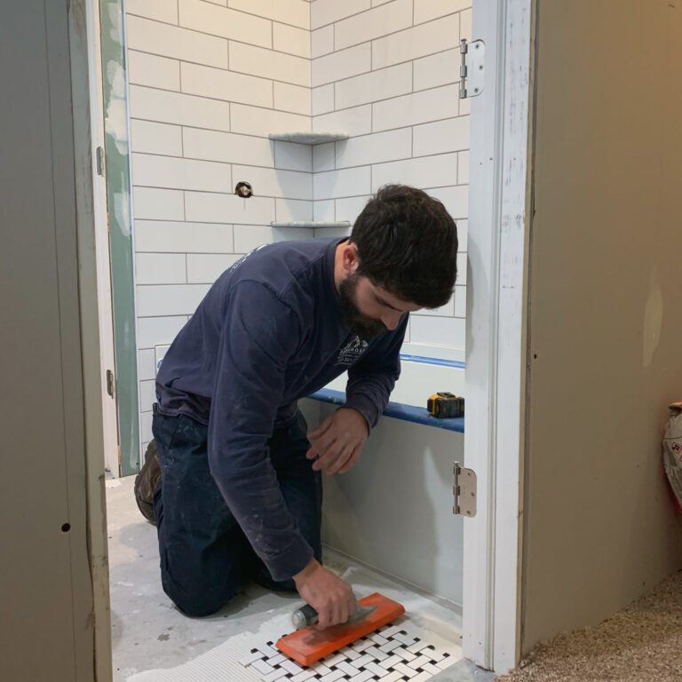 Image of replacing tiles in a bathroom remodel